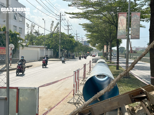 Dự án hầm chui Nguyễn Văn Linh hơn 830 tỷ đồng chậm tiến độ di dời hạ tầng kỹ thuật - Ảnh 4.
