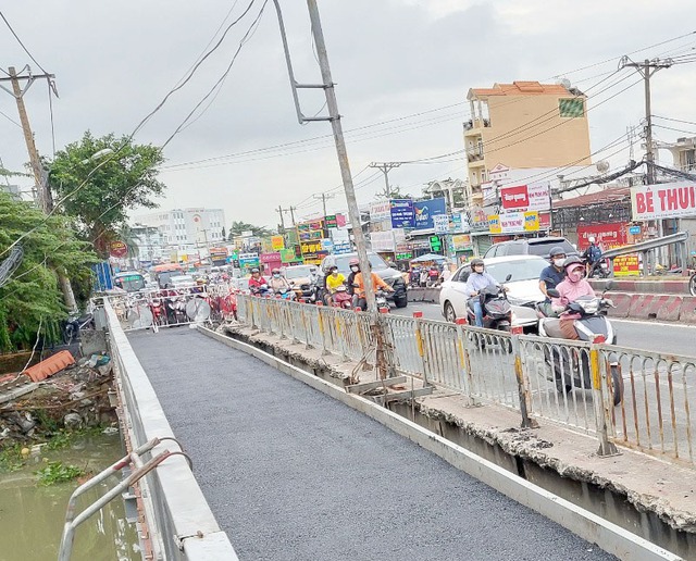 TP. HCM điều chỉnh giao thông cầu Ông Dầu xóa nút thắt kẹt xe trên Quốc lộ 13 - Ảnh 3.