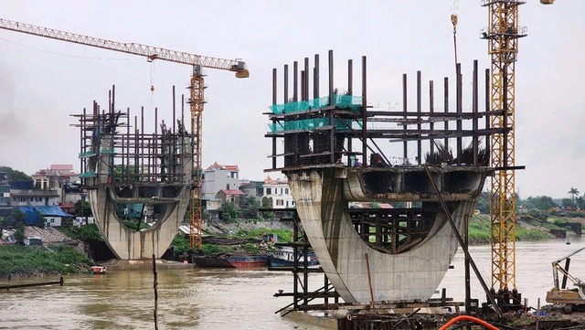 Bộ Xây dựng đề nghị Hà Nội quyết liệt giải phóng mặt bằng dự án cầu Đuống- Ảnh 1.