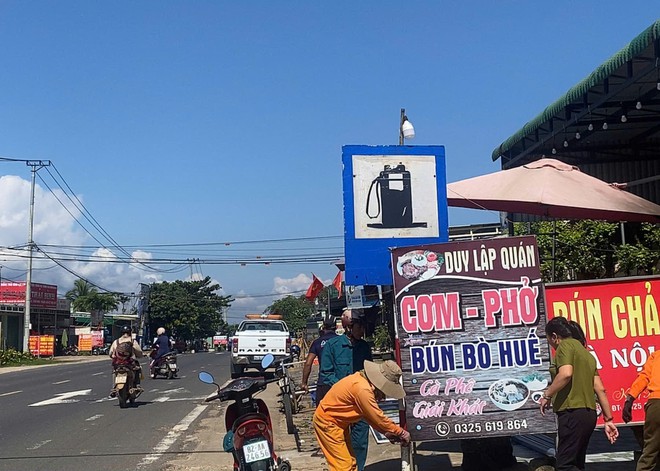 Hợp sức giải toả hành lang ATGT trên tuyến đường Hồ Chí Minh - Ảnh 10.