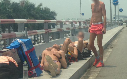 Trưa nóng 40 độ, khách Tây vô tư phơi nắng ở sân bay Nội Bài